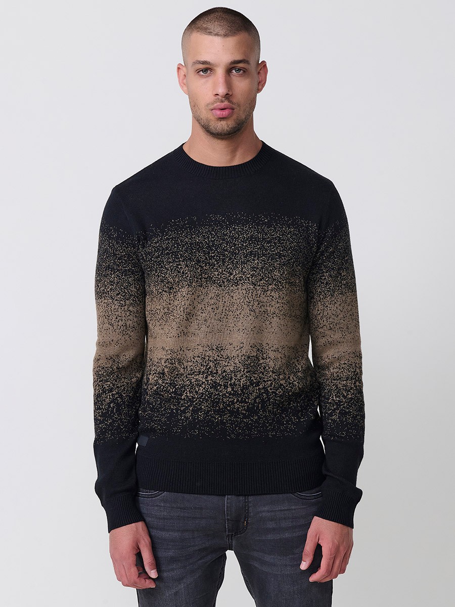 Jersey visón de hombre en tricot con cuello redondo y manga larga. Tejido 100% acrílico, cómodo, versátil y atemporal.