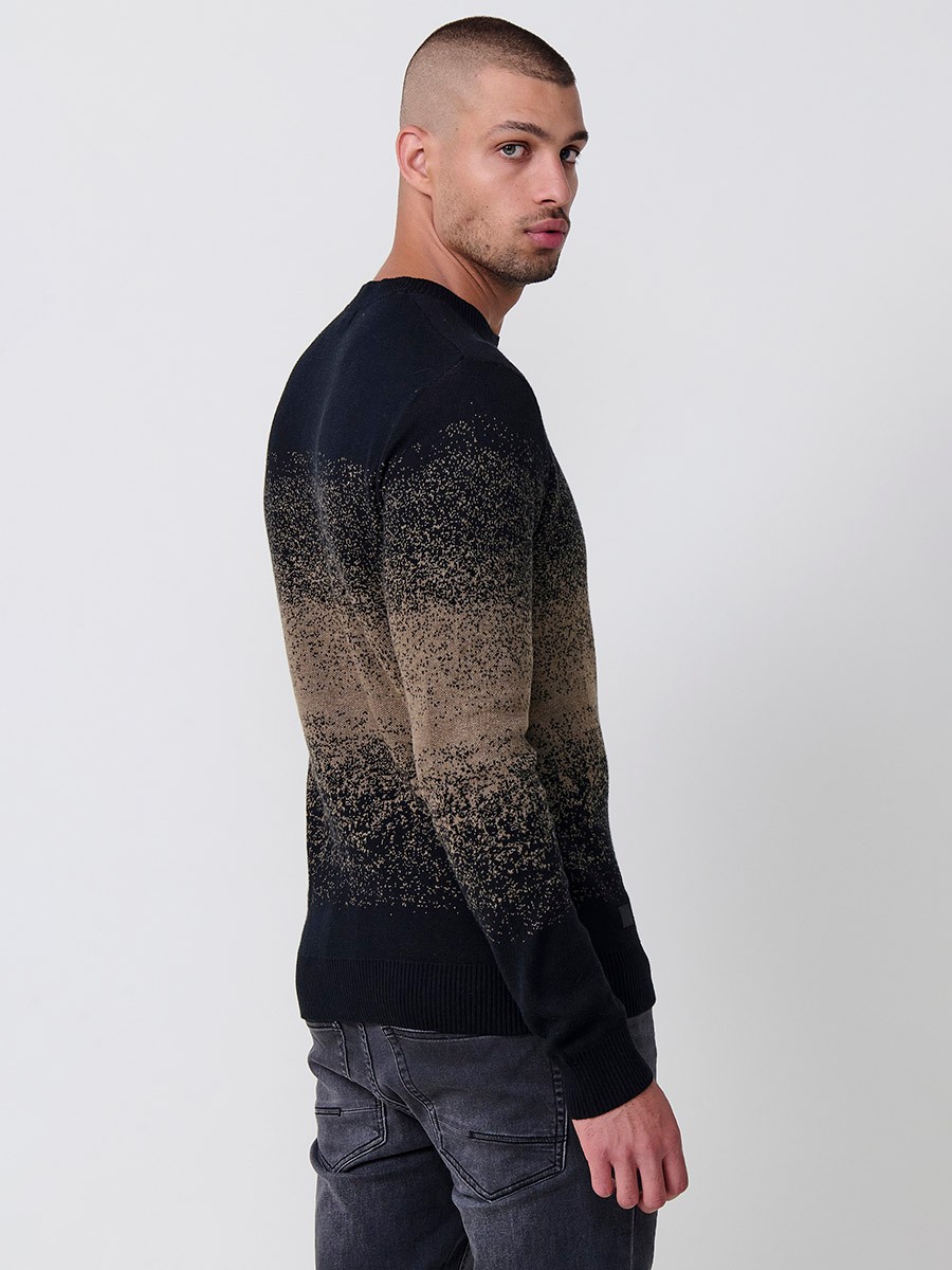 Jersey visón de hombre en tricot con cuello redondo y manga larga. Tejido 100% acrílico, cómodo, versátil y atemporal.