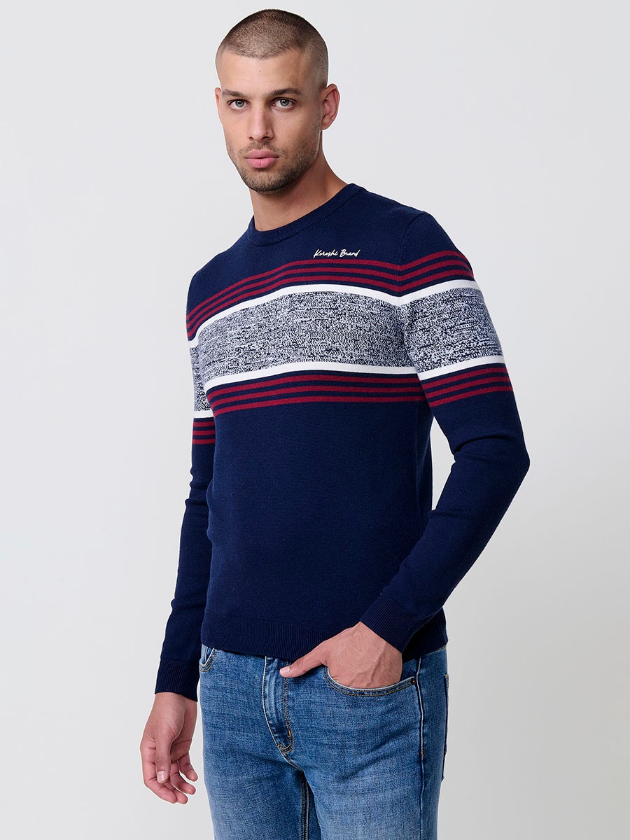Jersey navy de hombre en tricot con cuello redondo, manga larga y detalle de rayas centrales. Mezcla de viscosa, poliamida y poliéster.