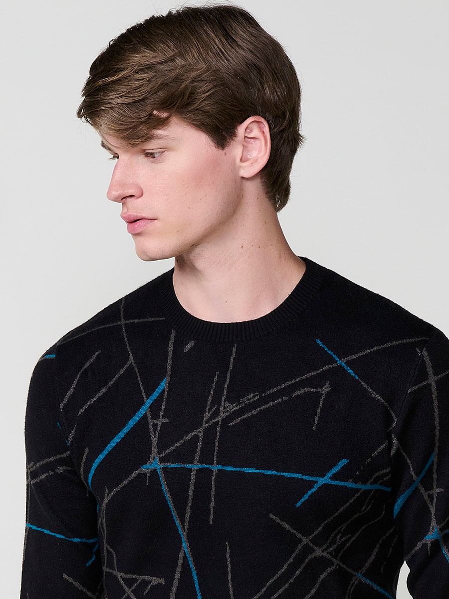 Jersey negro de hombre en tricot con cuello redondo y manga larga. Tejido 100% acrílico, cómodo, versátil y atemporal.