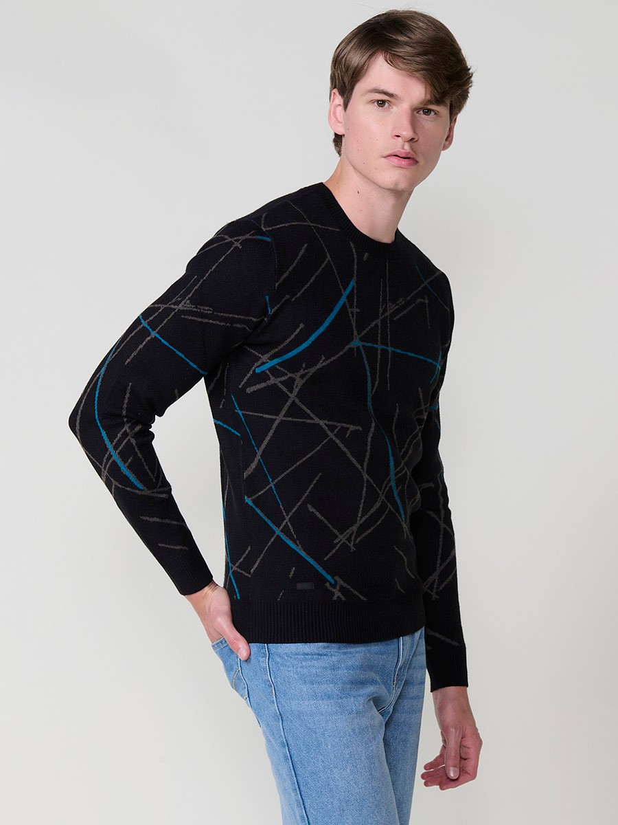 Jersey negro de hombre en tricot con cuello redondo y manga larga. Tejido 100% acrílico, cómodo, versátil y atemporal.