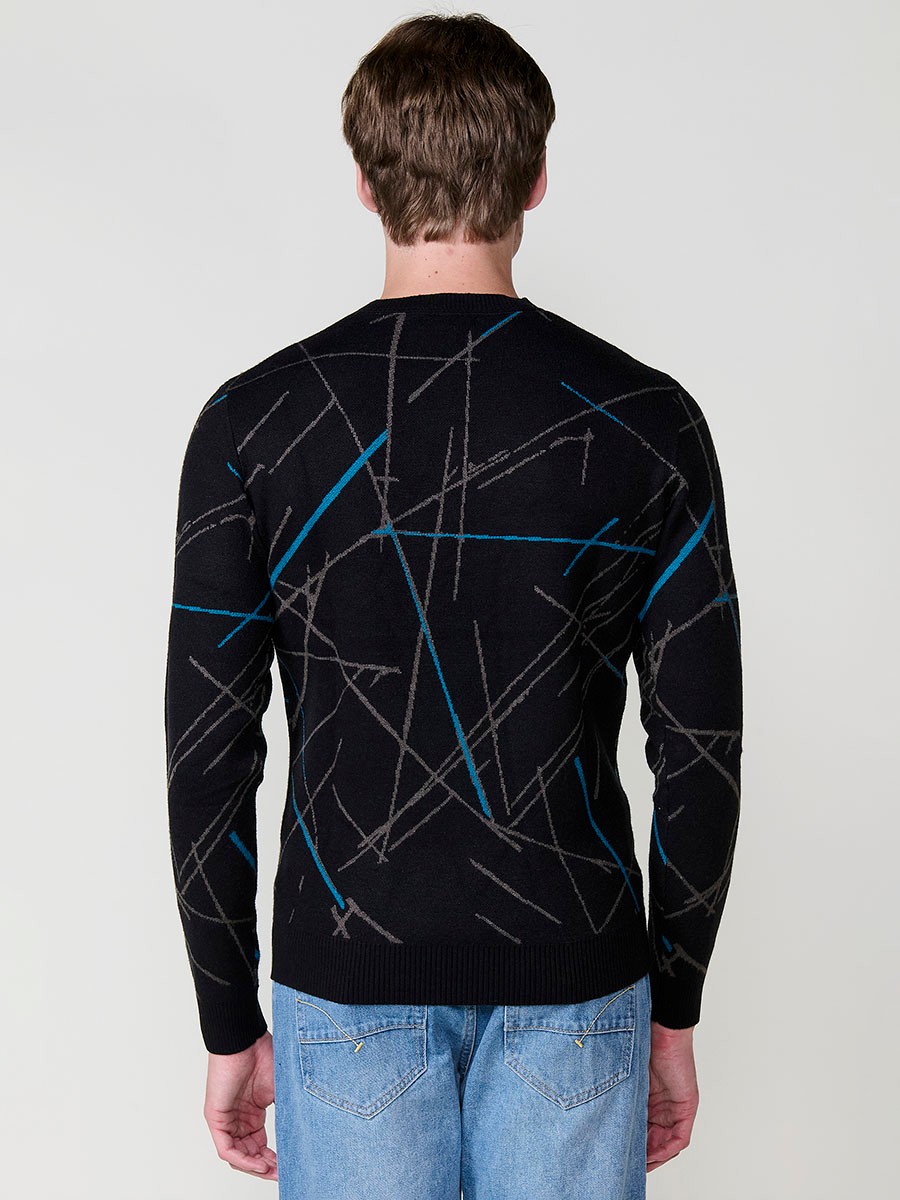 Jersey negro de hombre en tricot con cuello redondo y manga larga. Tejido 100% acrílico, cómodo, versátil y atemporal.