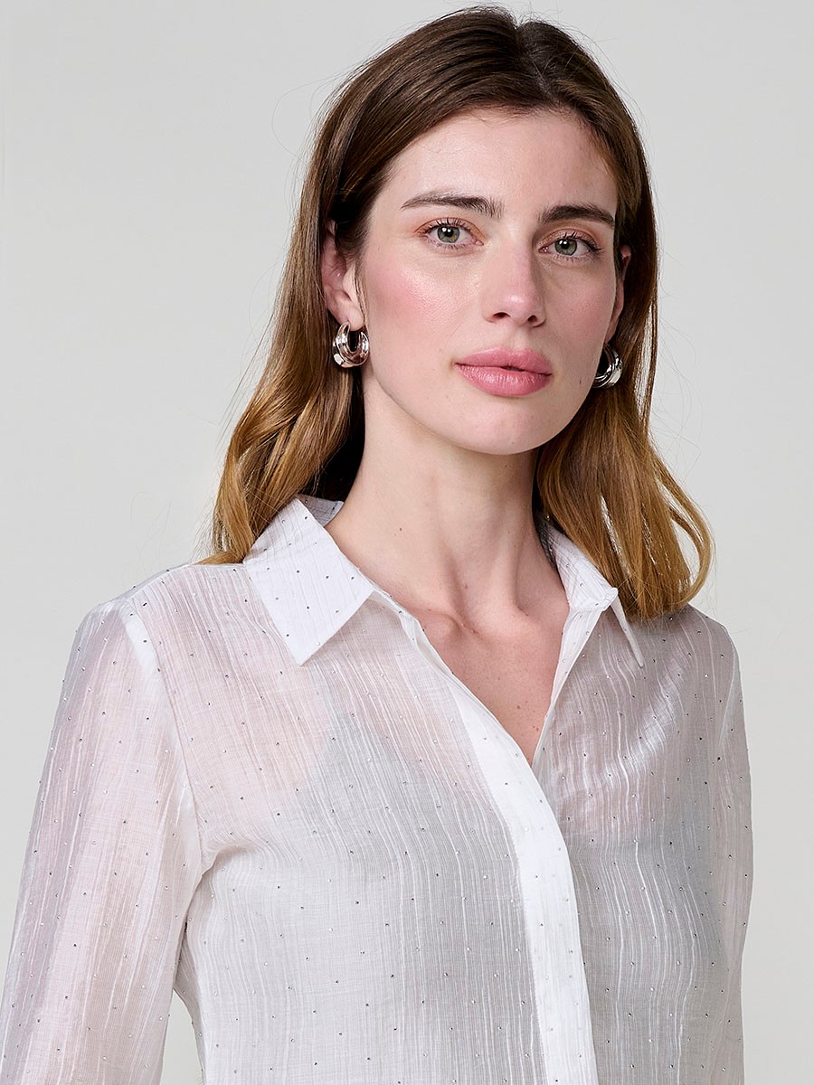 Women’s satin crinkle fabric shirt with mini sparkles, shirt collar, long sleeves and hidden button placket.