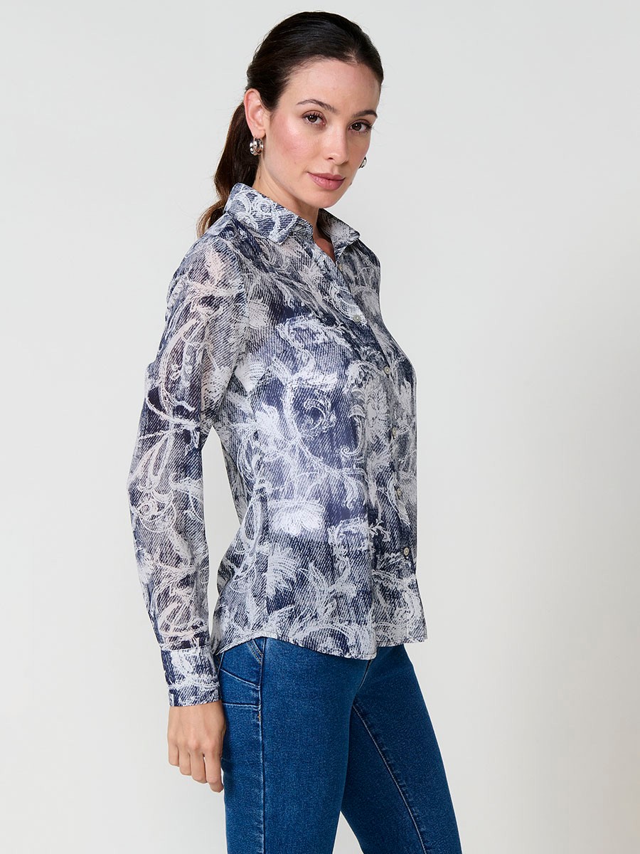Women’s chiffon shirt with floral print and button closure.