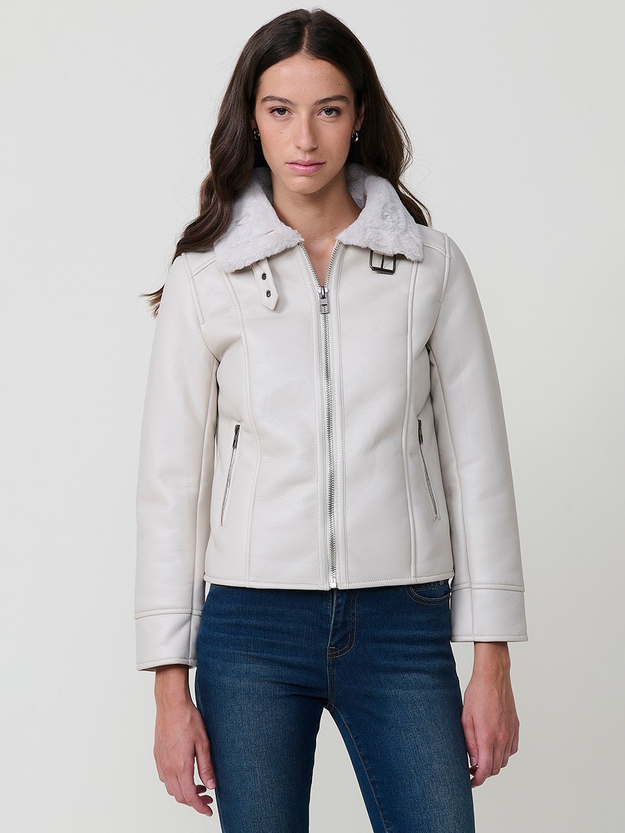 Women’s white double-faced faux leather jacket with faux fur lining, metallic zip pockets and buckle neck detail.