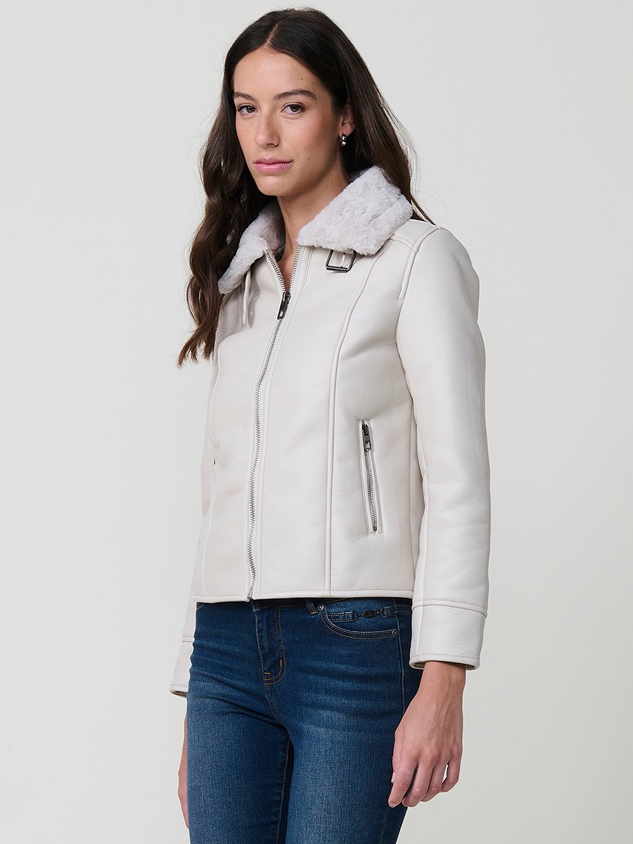 Women’s white double-faced faux leather jacket with faux fur lining, metallic zip pockets and buckle neck detail.