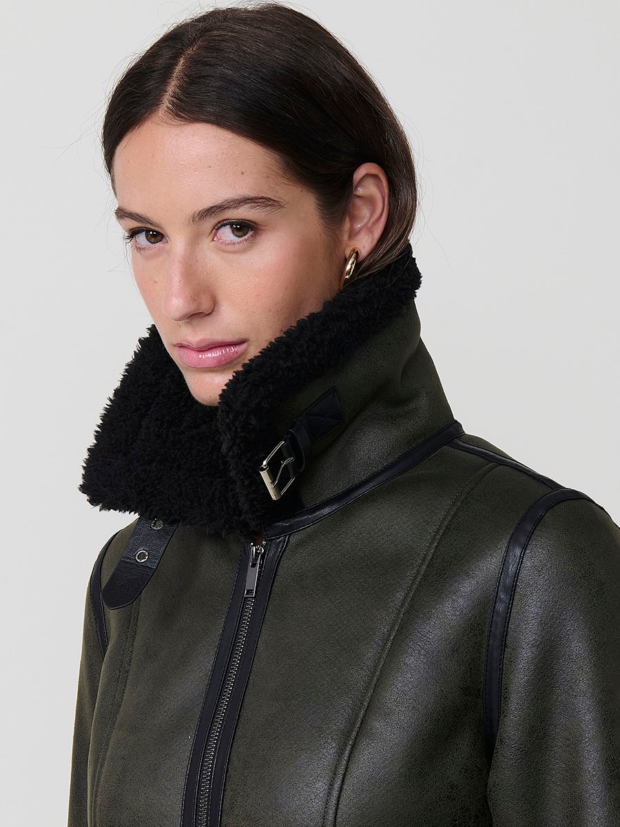 Women’s double-sided jacket, faux leather exterior, faux fur interior, metallic zipper and side buckles in khaki.