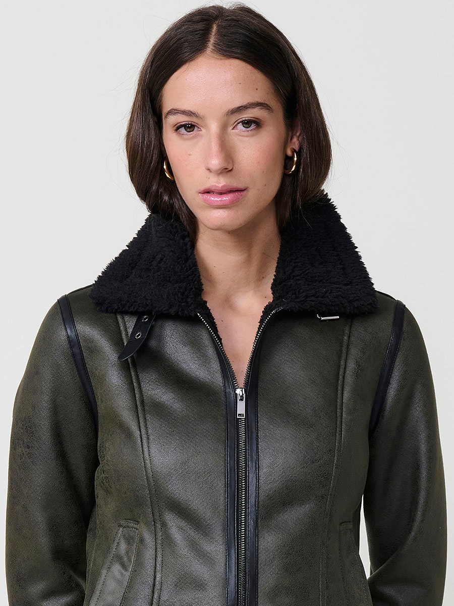 Women’s double-sided jacket, faux leather exterior, faux fur interior, metallic zipper and side buckles in khaki.