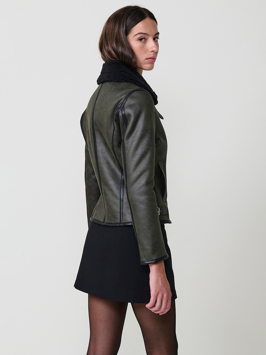 Women’s double-sided jacket, faux leather exterior, faux fur interior, metallic zipper and side buckles in khaki.