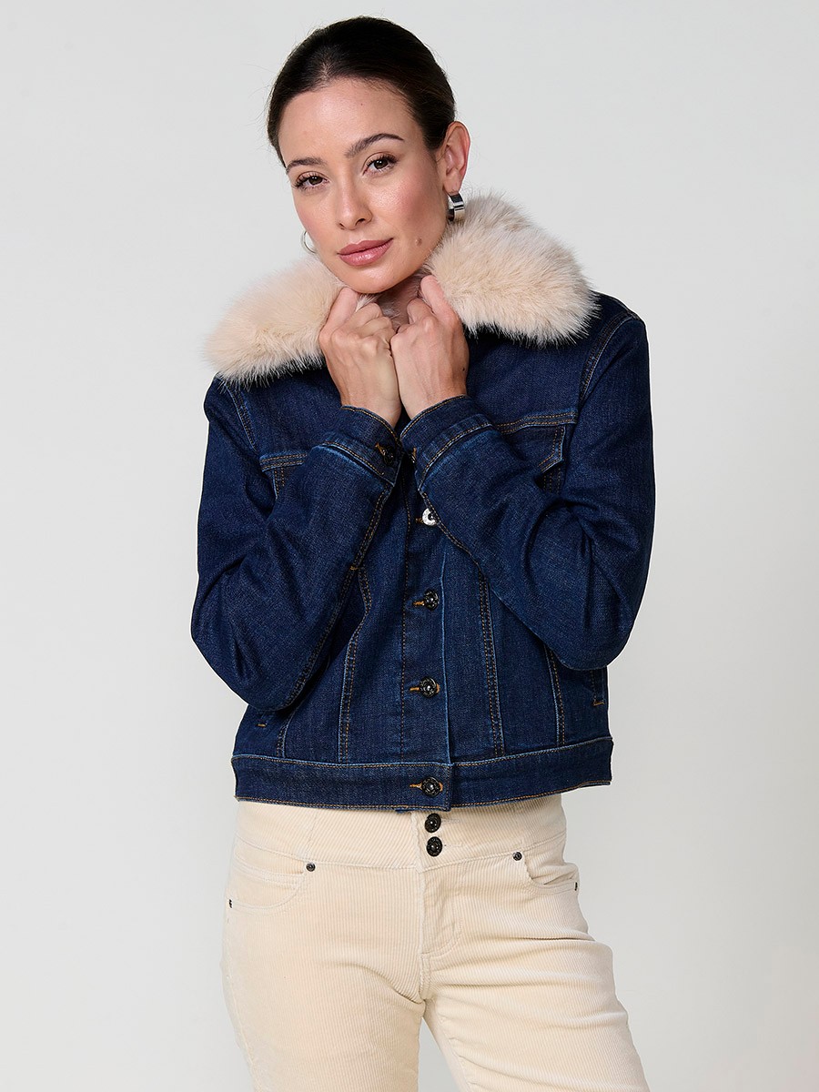 Women’s dark blue denim jacket with faux fur body lining, quilted sleeves, removable collar and metallic button closure.
