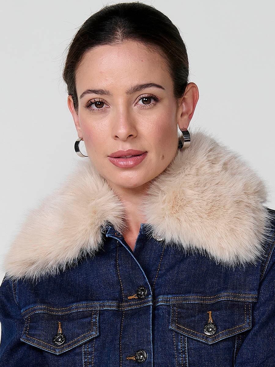 Women’s dark blue denim jacket with faux fur body lining, quilted sleeves, removable collar and metallic button closure.