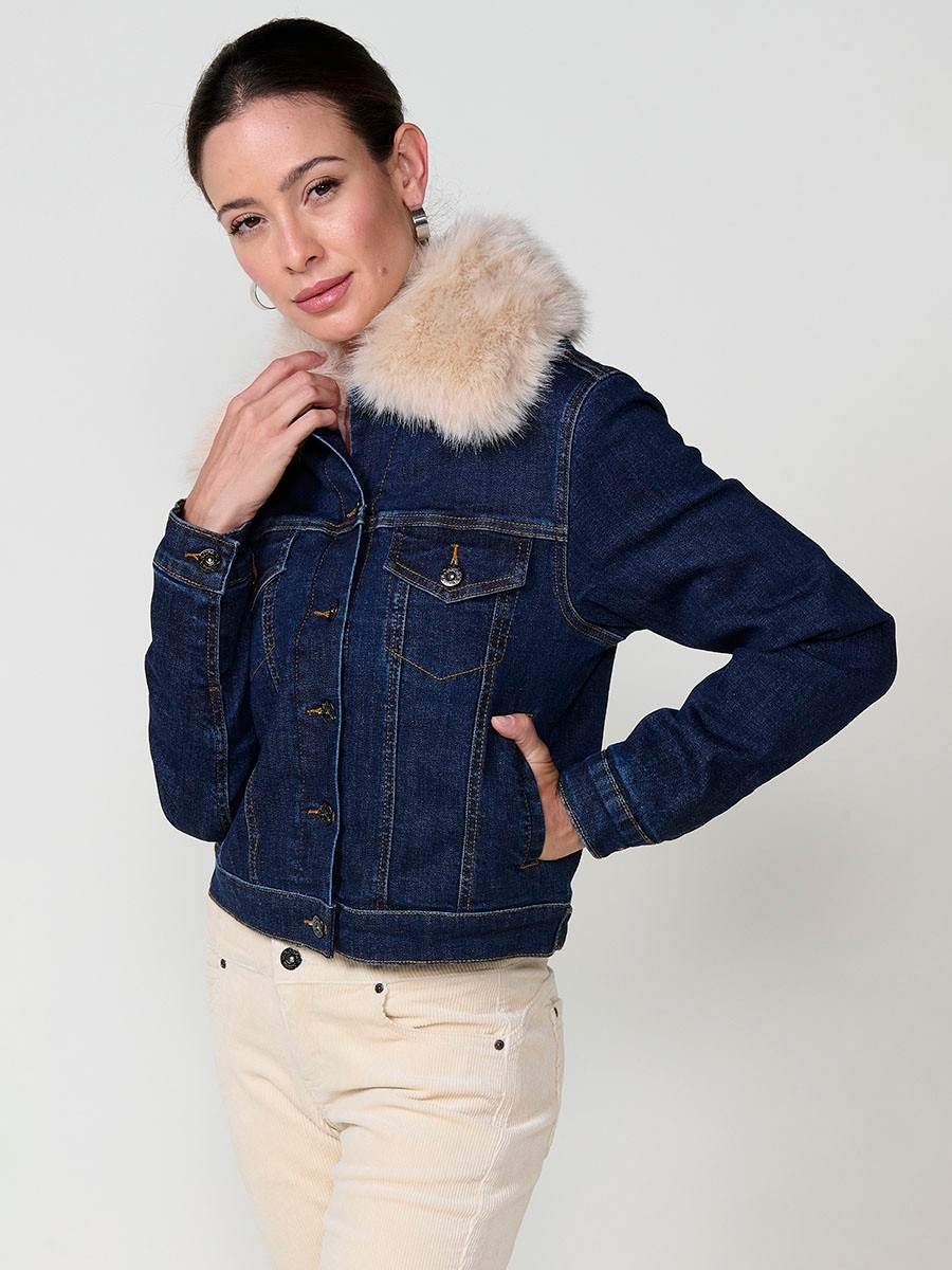 Women’s dark blue denim jacket with faux fur body lining, quilted sleeves, removable collar and metallic button closure.