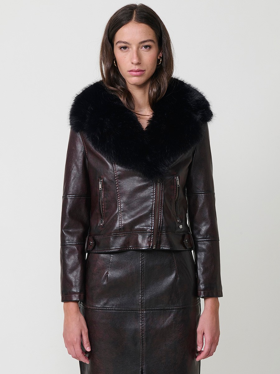 Women’s biker jacket in burgundy faux leather with faux fur lining, quilted sleeves, removable collar and zipper pockets. 8