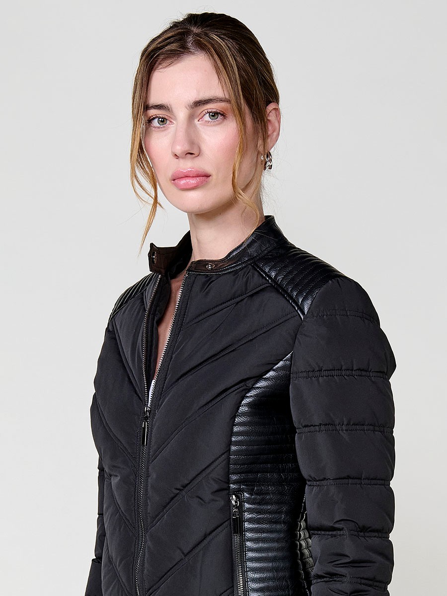 Women’s quilted faux leather biker jacket in black with mao collar, metallic zippers and stitched shoulder details.