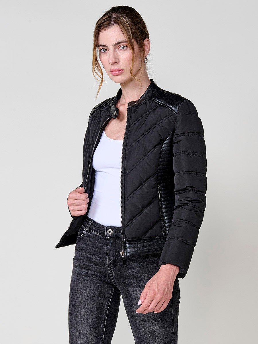Women’s quilted faux leather biker jacket in black with mao collar, metallic zippers and stitched shoulder details.