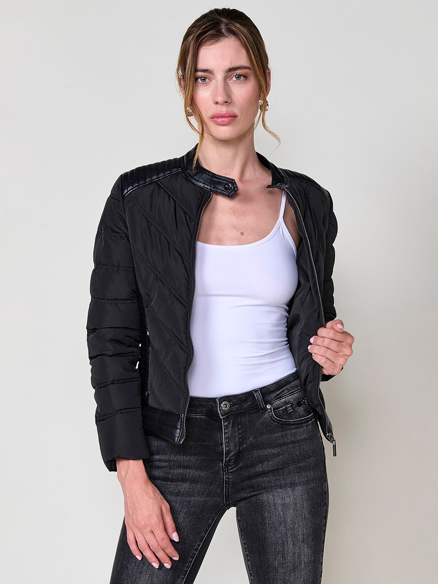 Women’s quilted faux leather biker jacket in black with mao collar, metallic zippers and stitched shoulder details.