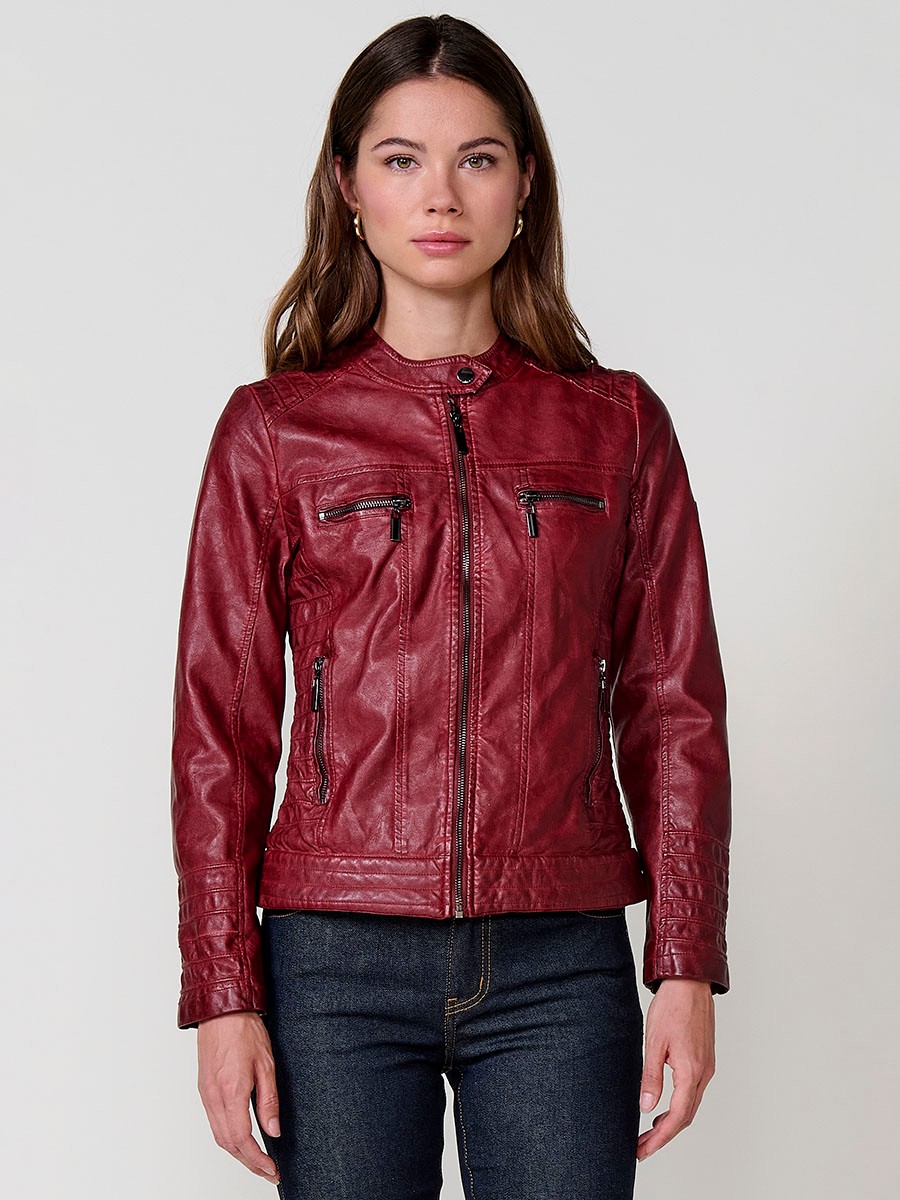 Women’s biker jacket in burgundy faux leather, mao collar, faux fur lining, quilted sleeves and metallic zippers.