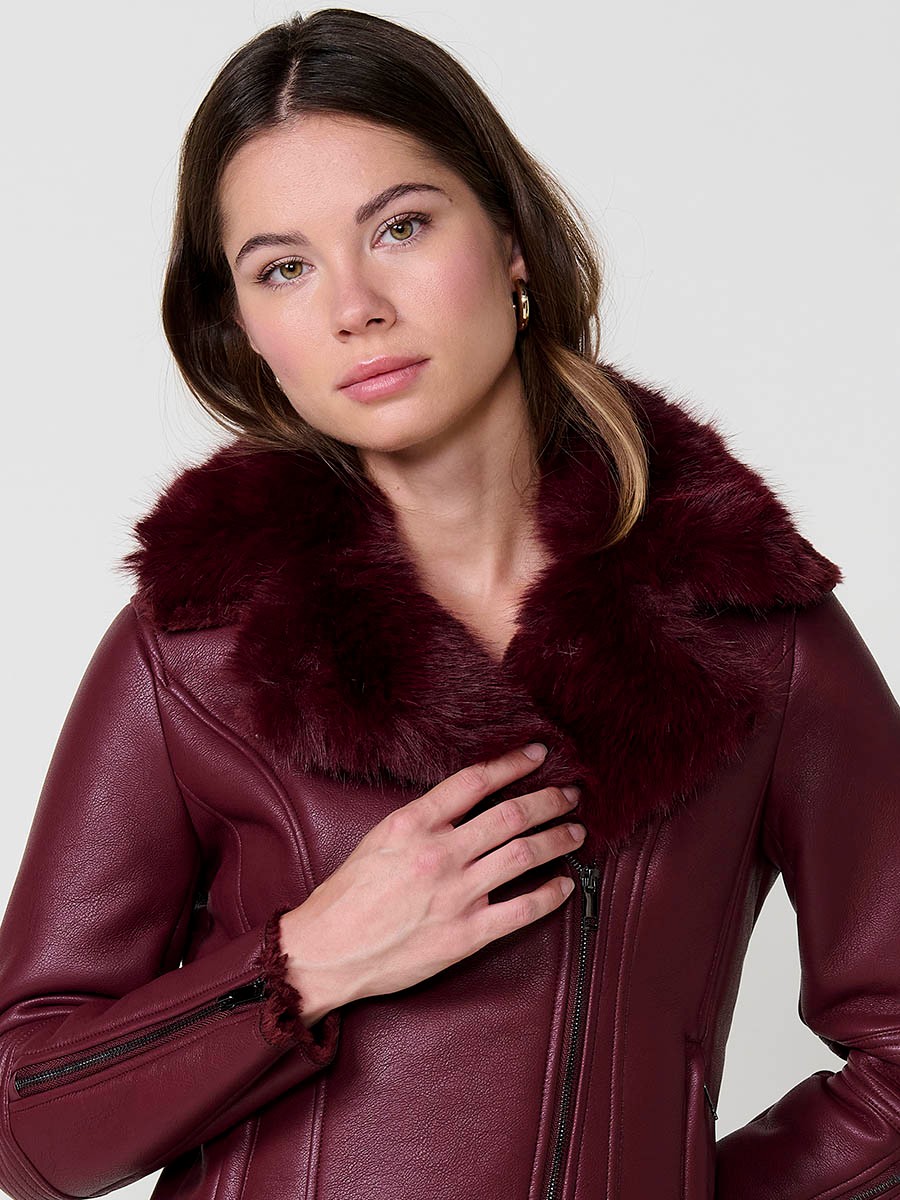 Women’s burgundy crossover jacket with detachable faux fur collar, versatile and elegant, made from 100% polyester.