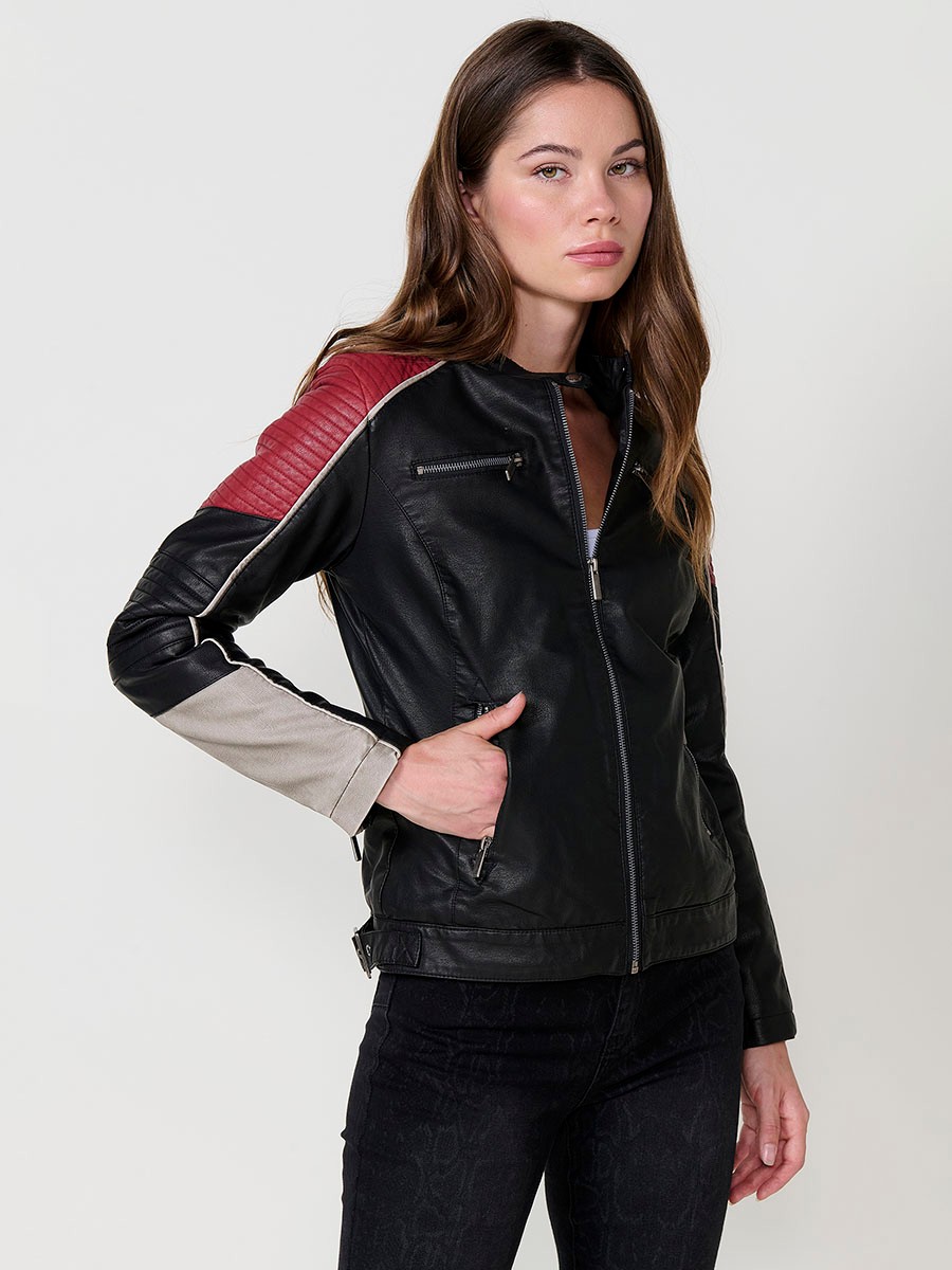 Women’s biker jacket in black faux leather with mao collar, contrast details, faux fur lining and metallic zippers.
