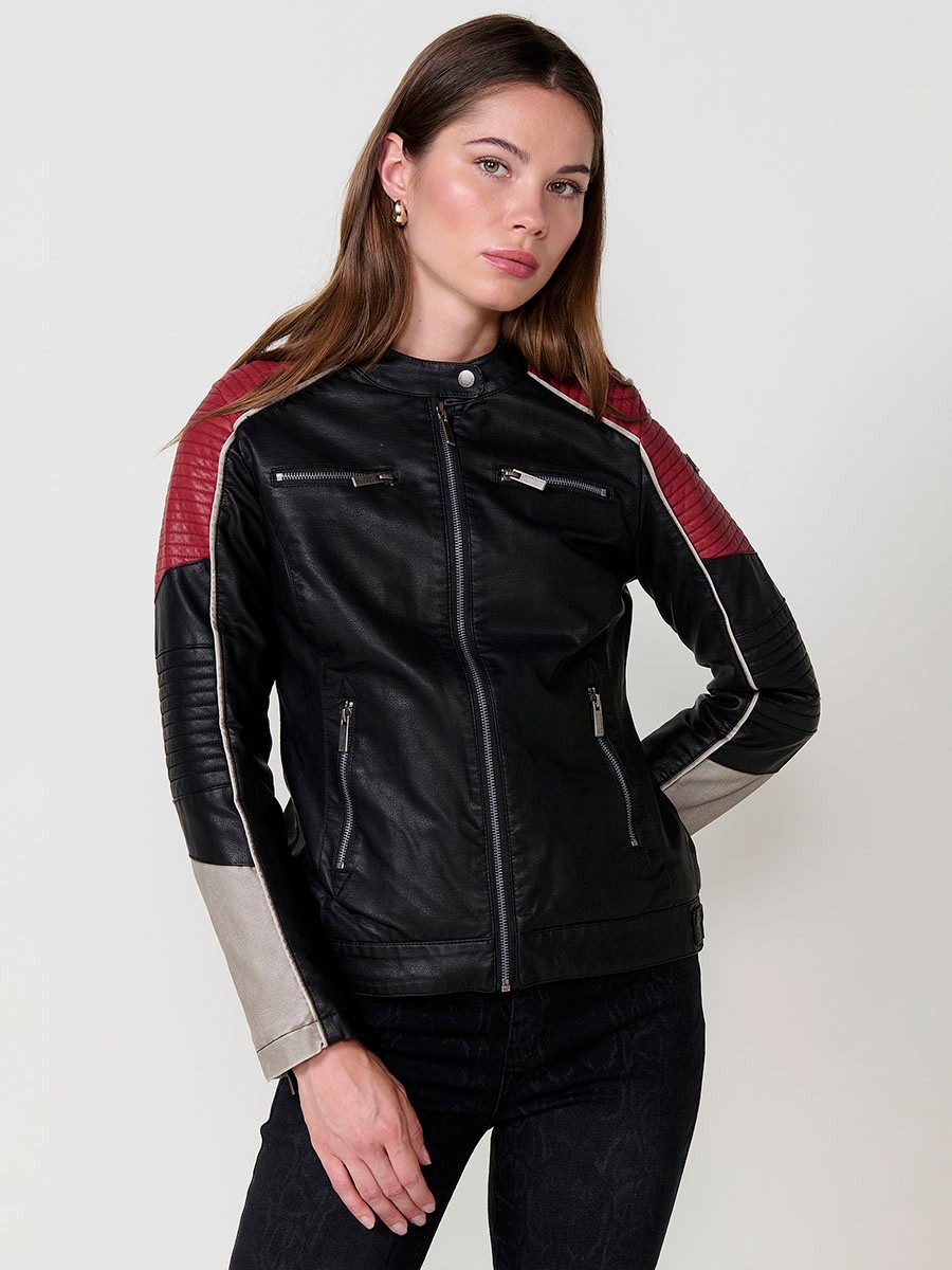 Women’s biker jacket in black faux leather with mao collar, contrast details, faux fur lining and metallic zippers.