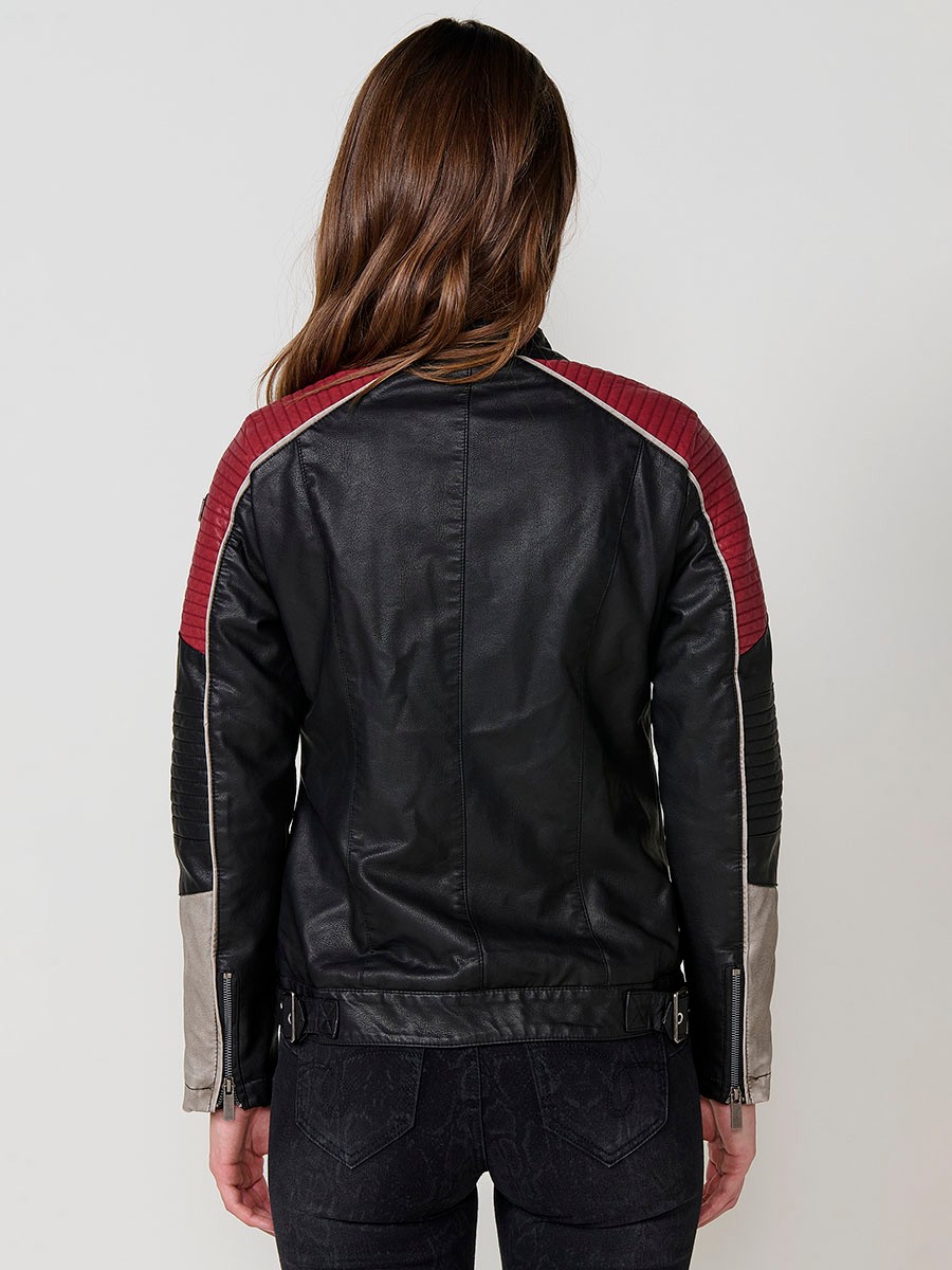 Women’s biker jacket in black faux leather with mao collar, contrast details, faux fur lining and metallic zippers.