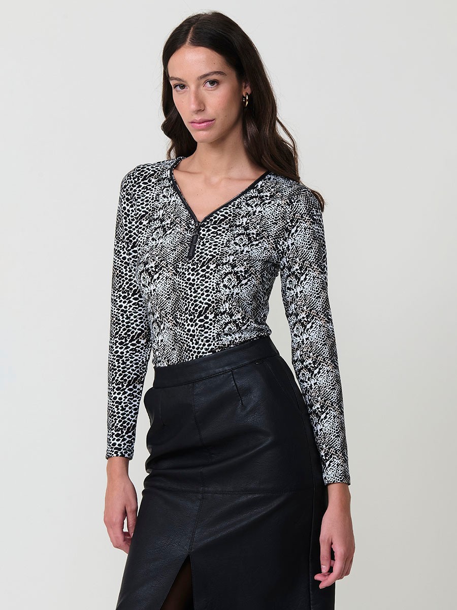 Women’s long sleeve animal print top with V-neckline, metallic ring zipper, and Koröshi logo plate.
