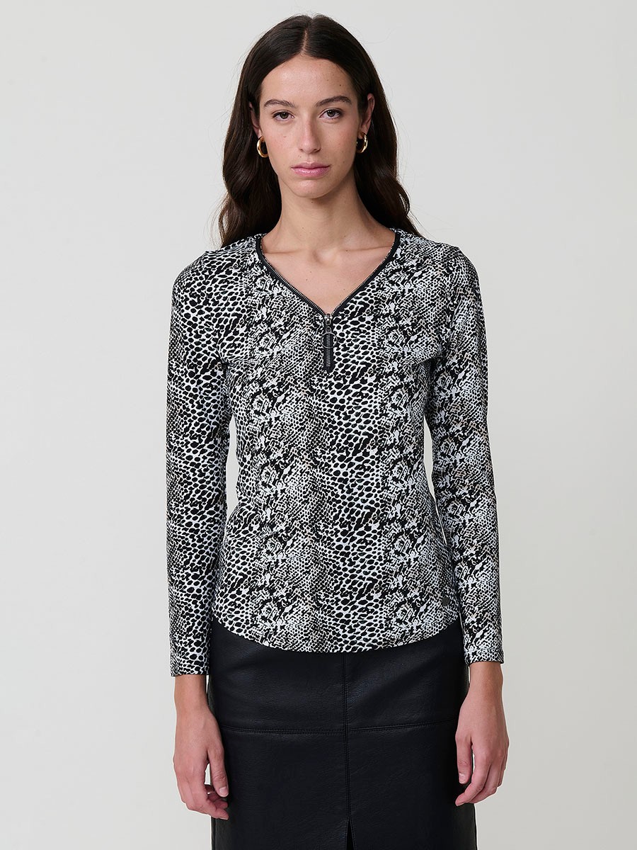 Women’s long sleeve animal print top with V-neckline, metallic ring zipper, and Koröshi logo plate.