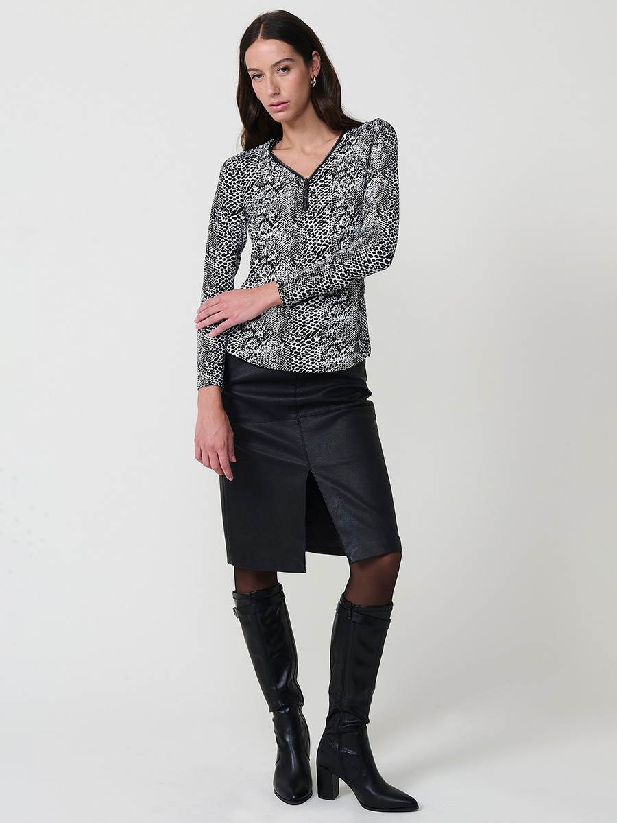 Women’s long sleeve animal print top with V-neckline, metallic ring zipper, and Koröshi logo plate.