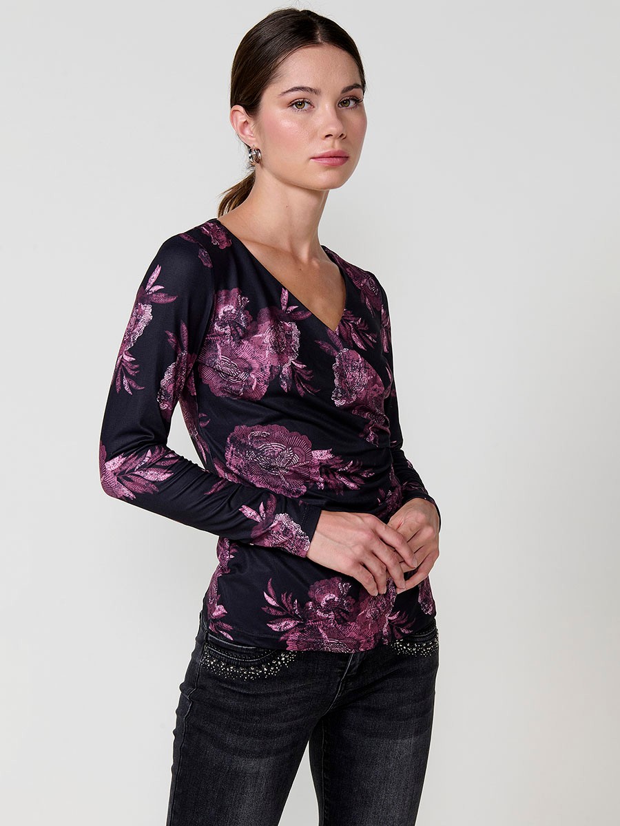 Women’s long sleeve floral top with wrap V-neckline and ruched front. Koröshi metal logo plate.