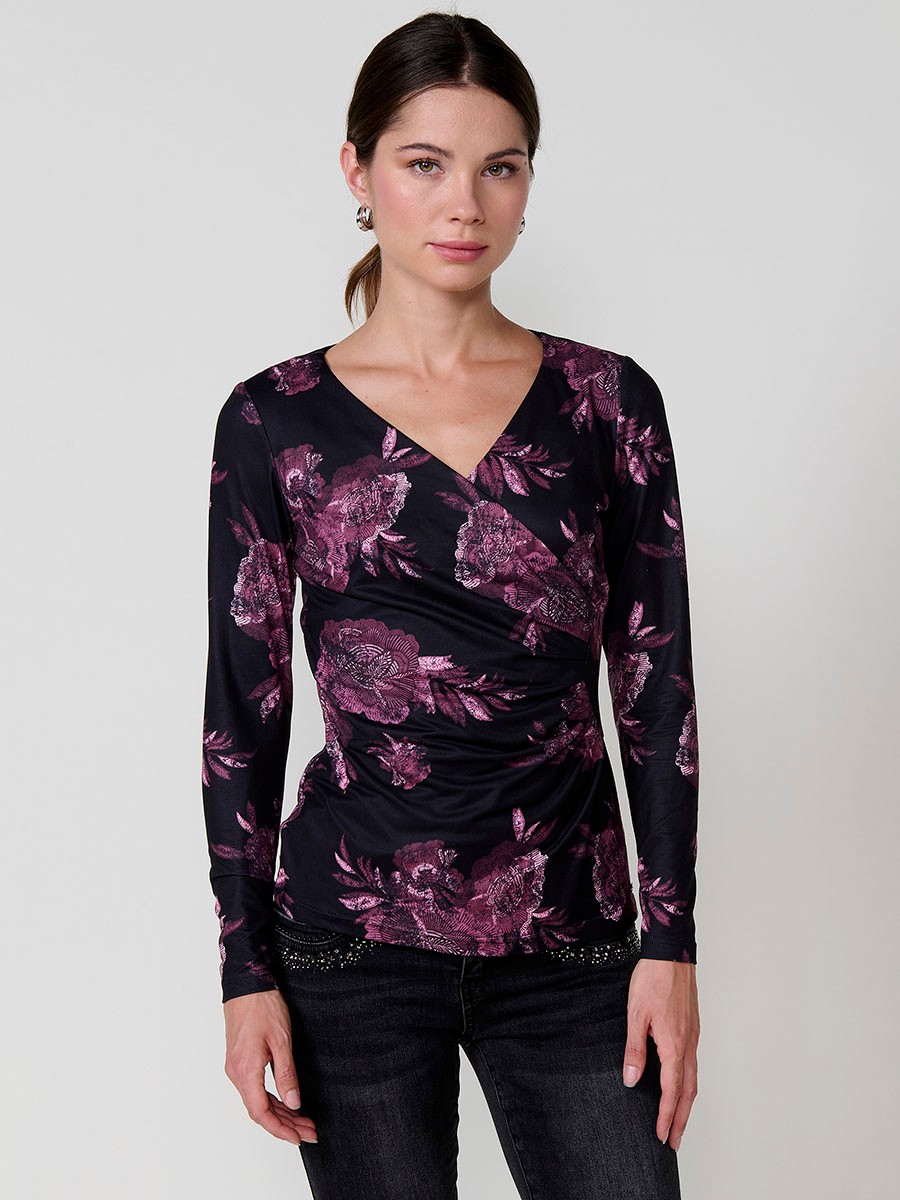Women’s long sleeve floral top with wrap V-neckline and ruched front. Koröshi metal logo plate.