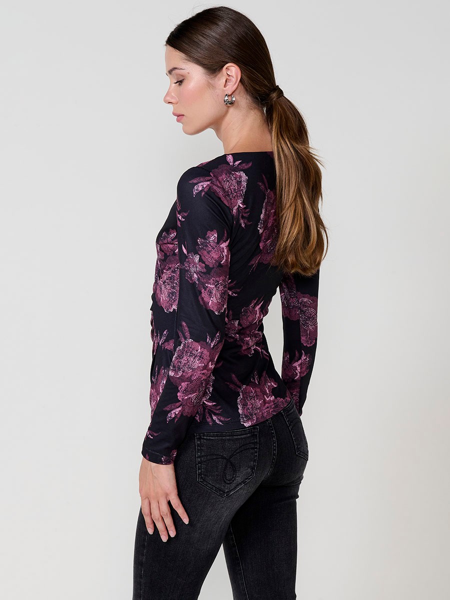 Women’s long sleeve floral top with wrap V-neckline and ruched front. Koröshi metal logo plate.