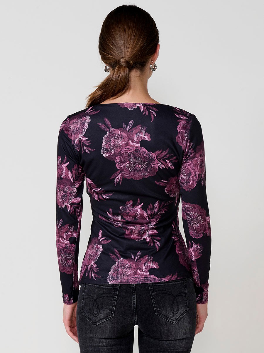 Women’s long sleeve floral top with wrap V-neckline and ruched front. Koröshi metal logo plate.