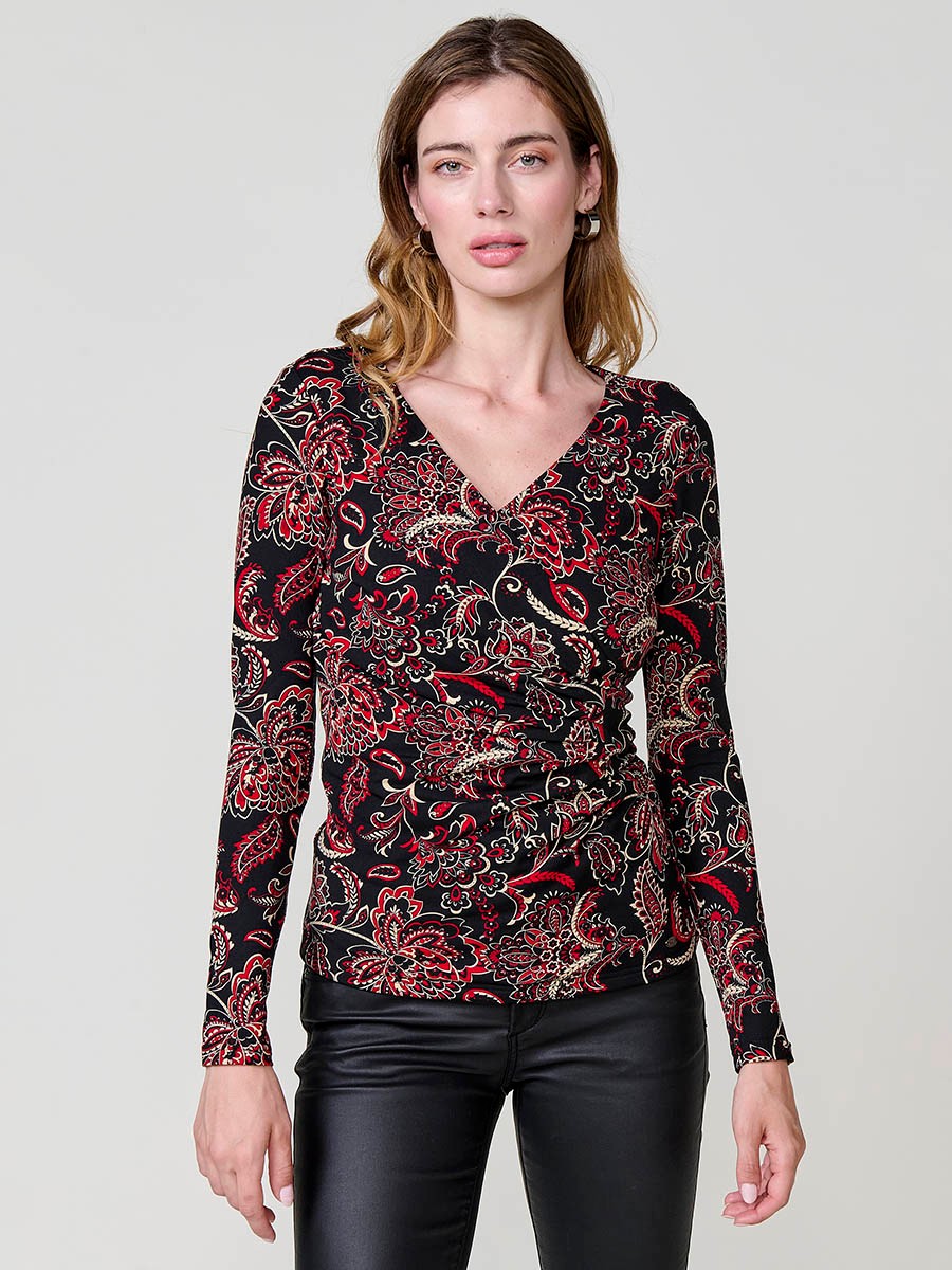 Women’s long sleeve top with paisley print, wrap neckline and ruched front. Metallic Koröshi logo plate.