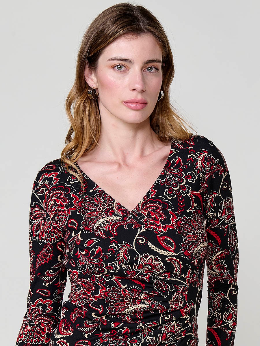 Women’s long sleeve top with paisley print, wrap neckline and ruched front. Metallic Koröshi logo plate.