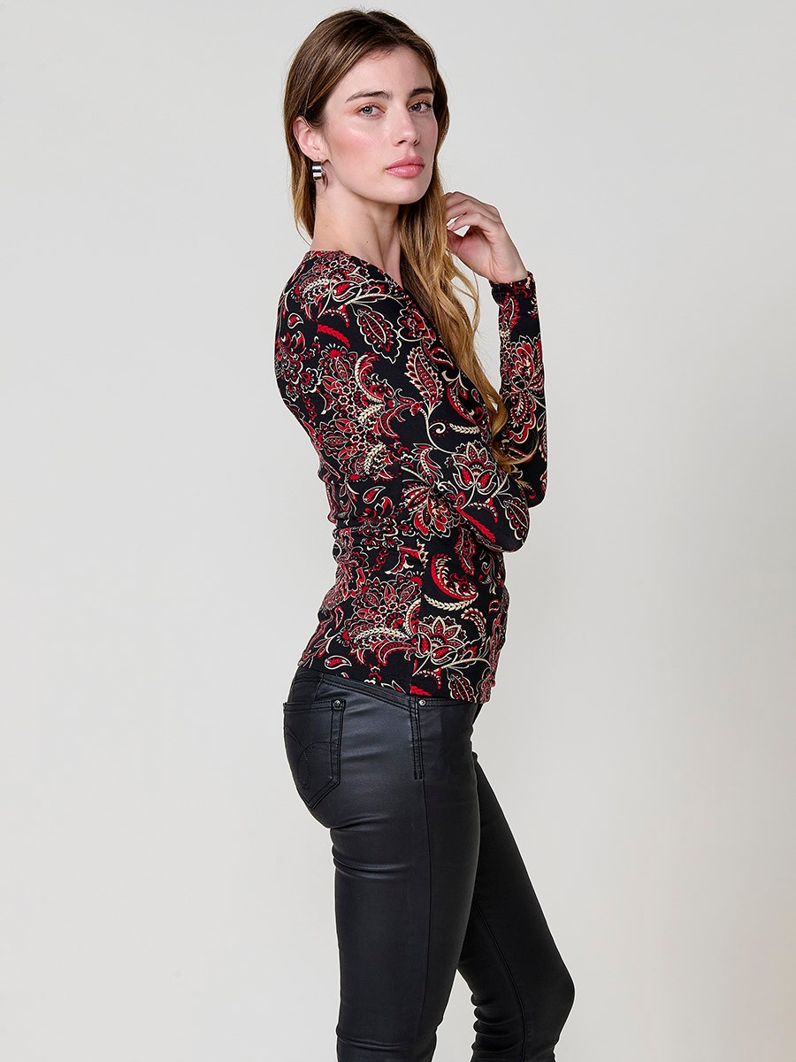 Women’s long sleeve top with paisley print, wrap neckline and ruched front. Metallic Koröshi logo plate.