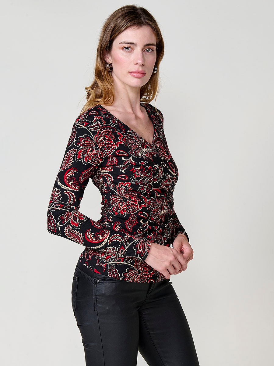 Women’s long sleeve top with paisley print, wrap neckline and ruched front. Metallic Koröshi logo plate.