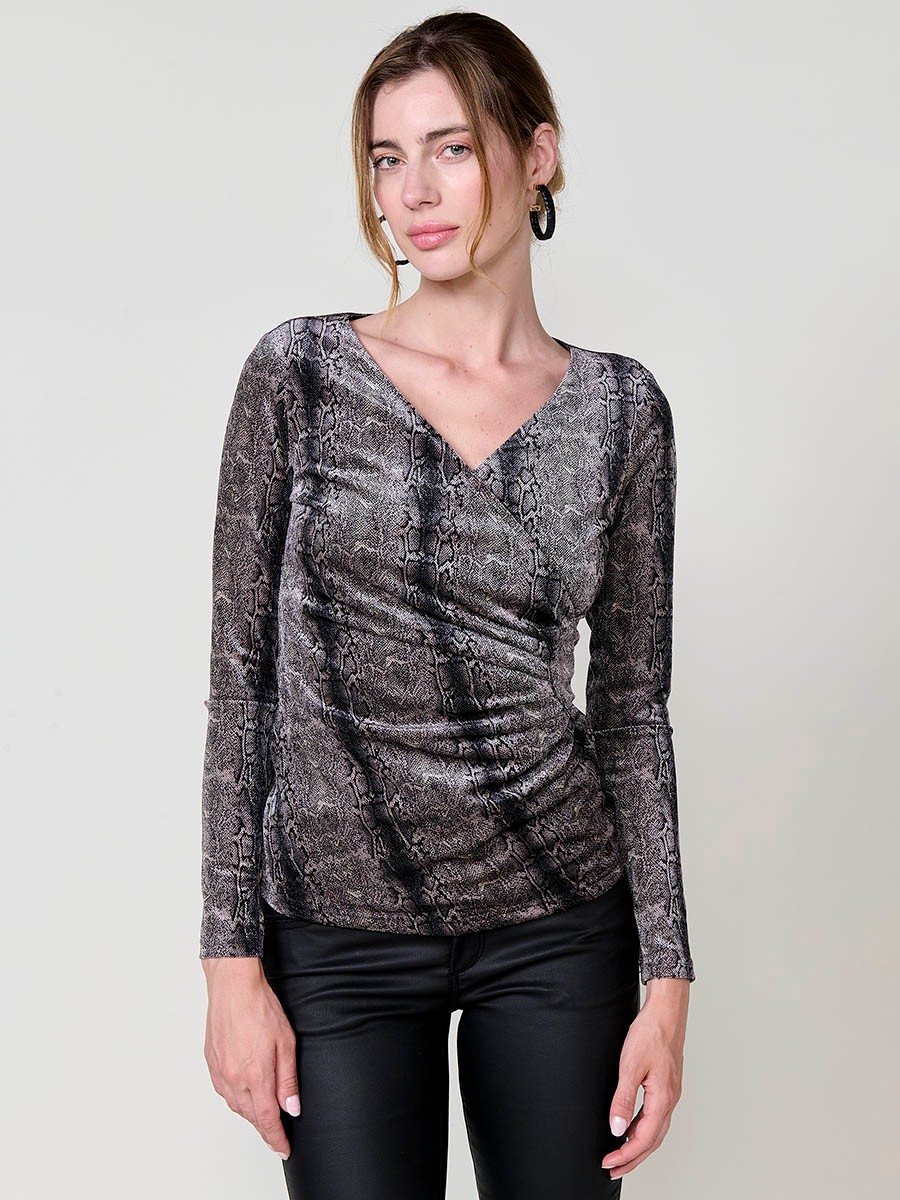 Women’s long sleeve top in velvet with animal print, wrap neckline and ruched front. Koröshi metal logo plate.