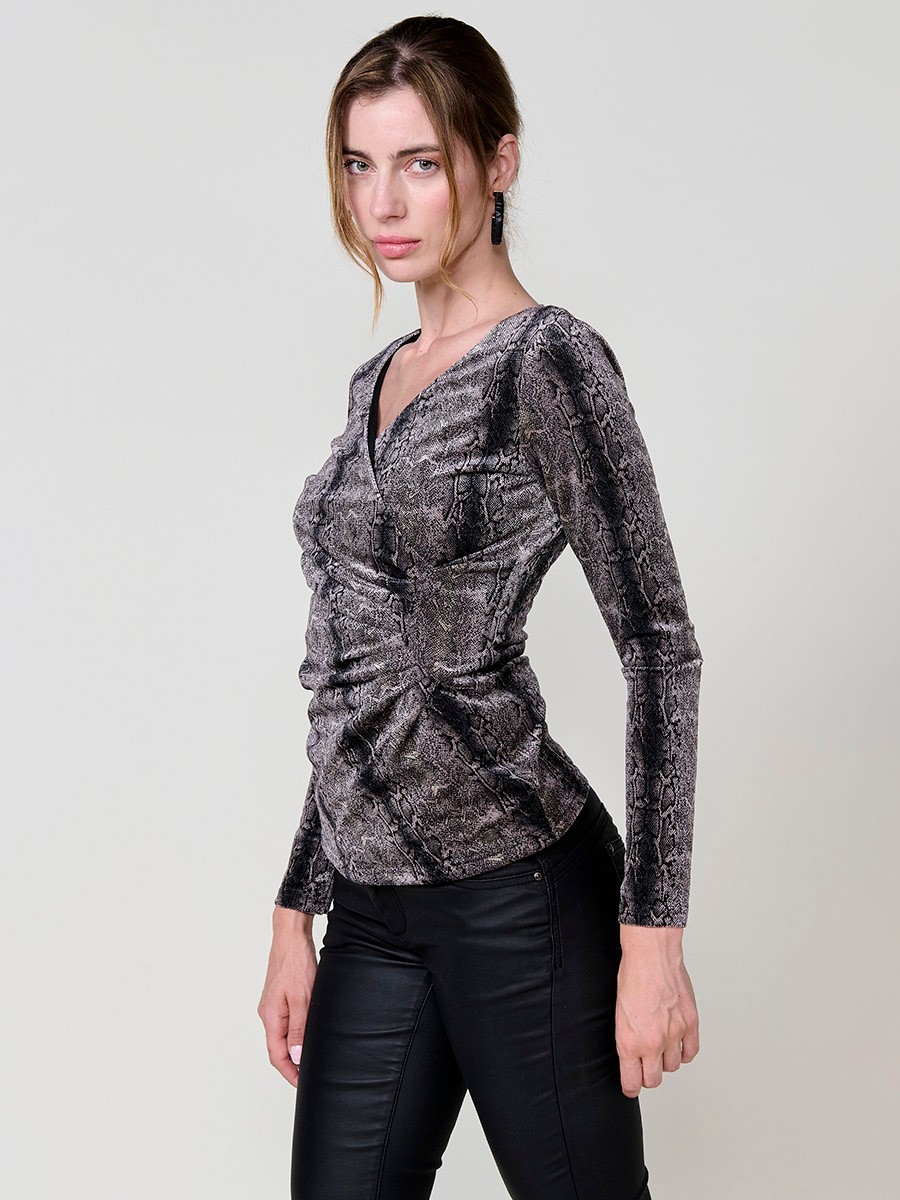 Women’s long sleeve top in velvet with animal print, wrap neckline and ruched front. Koröshi metal logo plate.