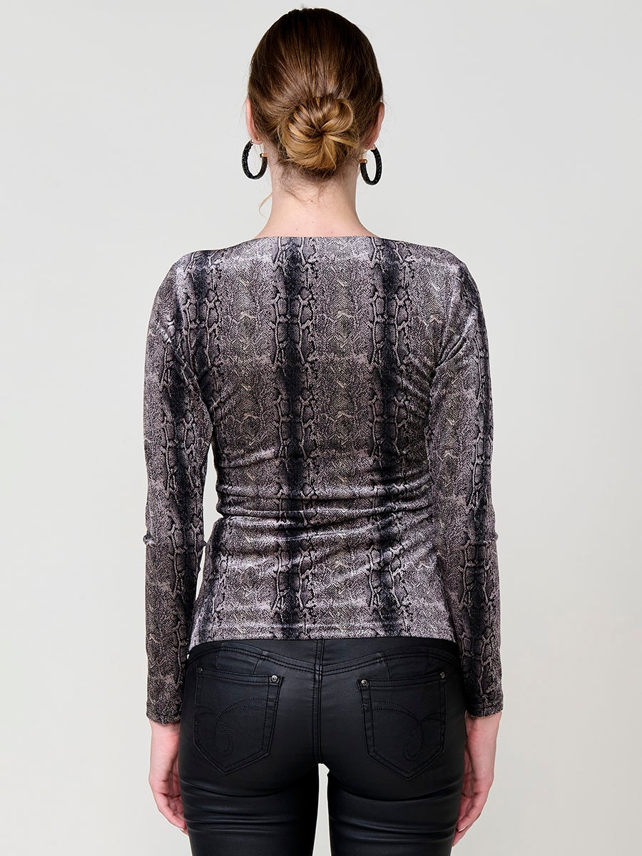 Women’s long sleeve top in velvet with animal print, wrap neckline and ruched front. Koröshi metal logo plate.