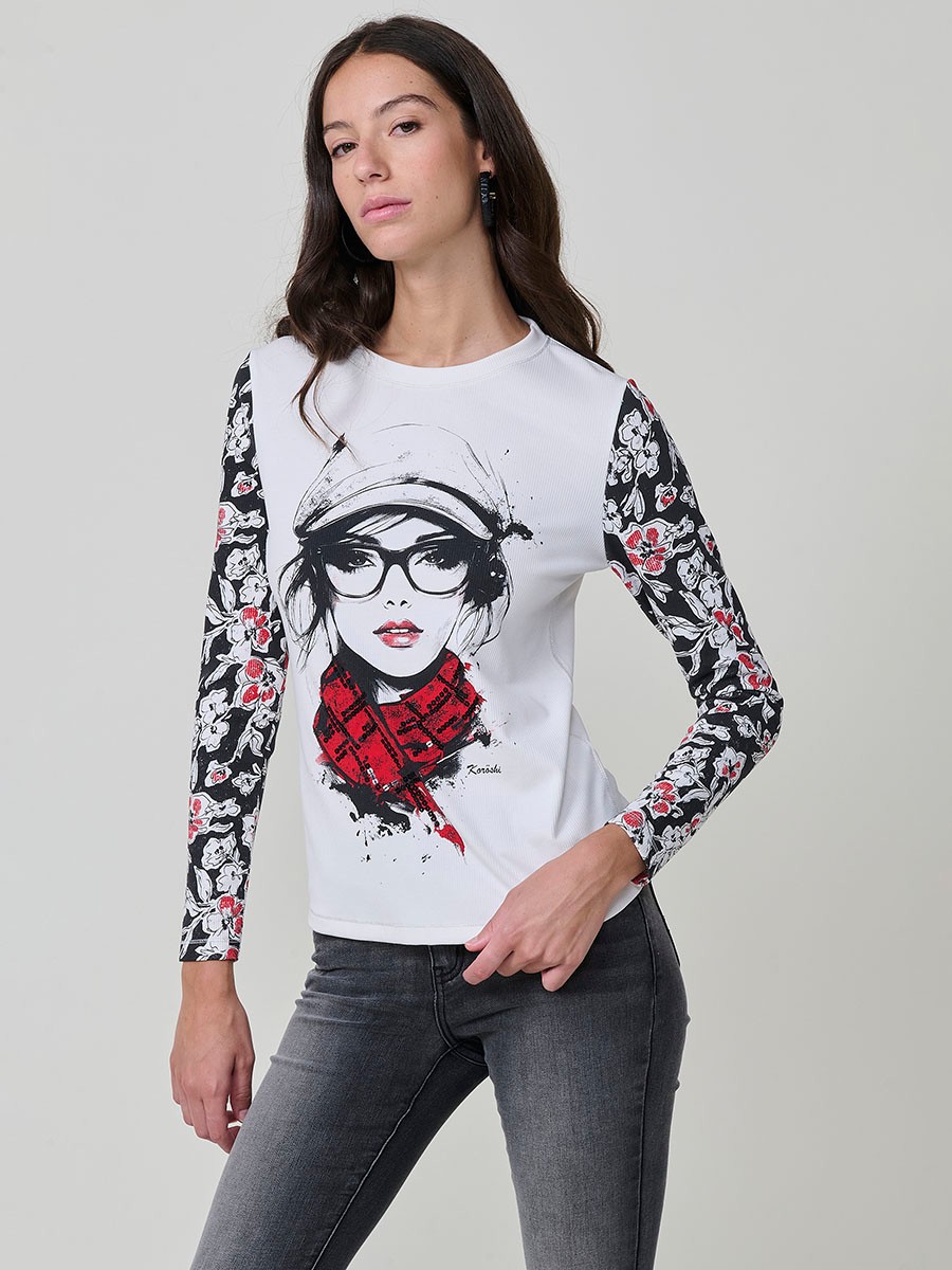Women’s long sleeve ribbed top with girl print and sequin details on the front, contrast printed sleeves, and metallic thread seams.