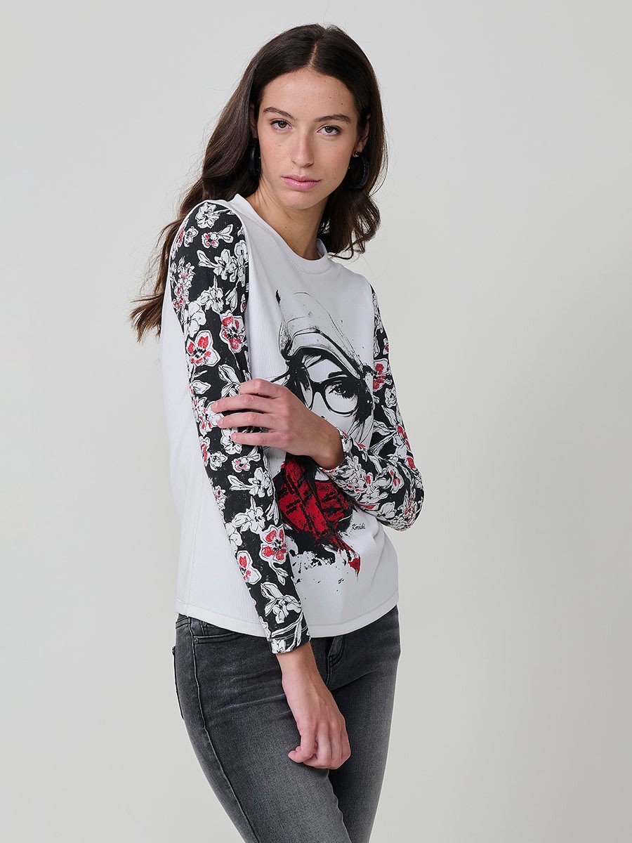 Women’s long sleeve ribbed top with girl print and sequin details on the front, contrast printed sleeves, and metallic thread seams.