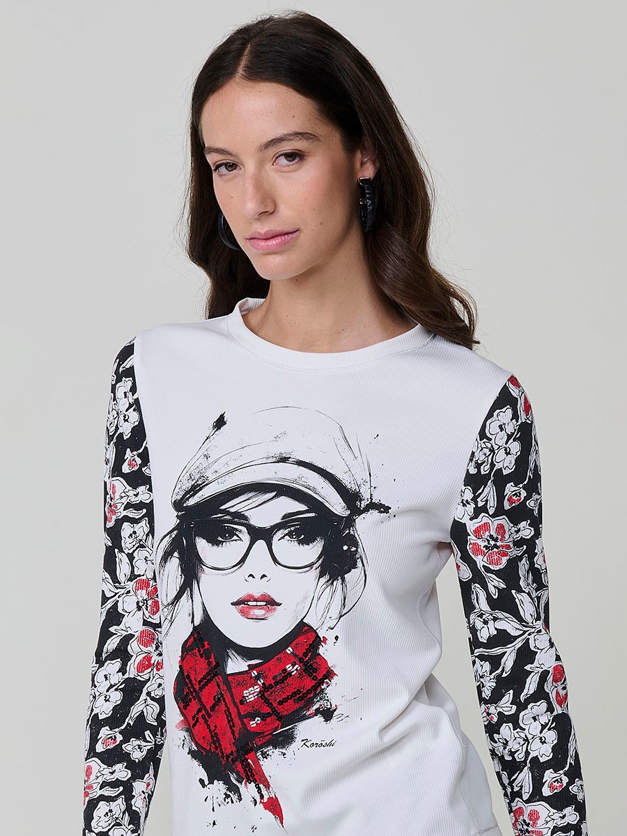 Women’s long sleeve ribbed top with girl print and sequin details on the front, contrast printed sleeves, and metallic thread seams.