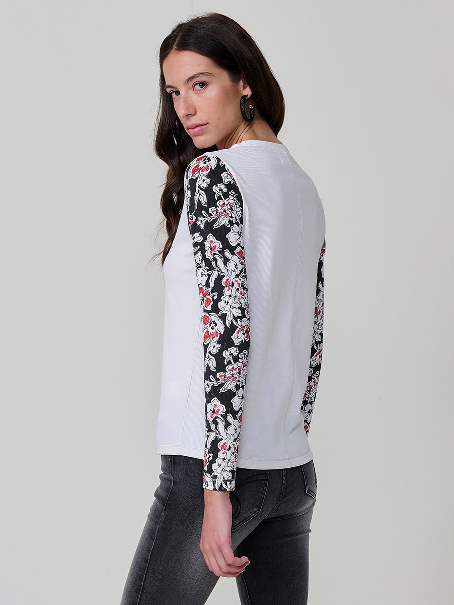 Women’s long sleeve ribbed top with girl print and sequin details on the front, contrast printed sleeves, and metallic thread seams.