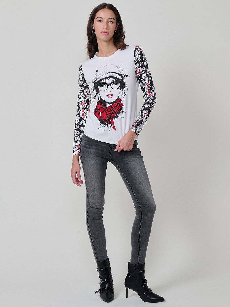 Women’s long sleeve ribbed top with girl print and sequin details on the front, contrast printed sleeves, and metallic thread seams.