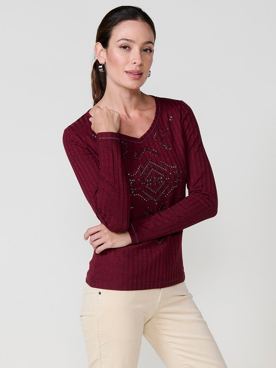 Women’s long sleeve ribbed top with melange effect, V-neckline and ethnic motif with studs and shiny accents.