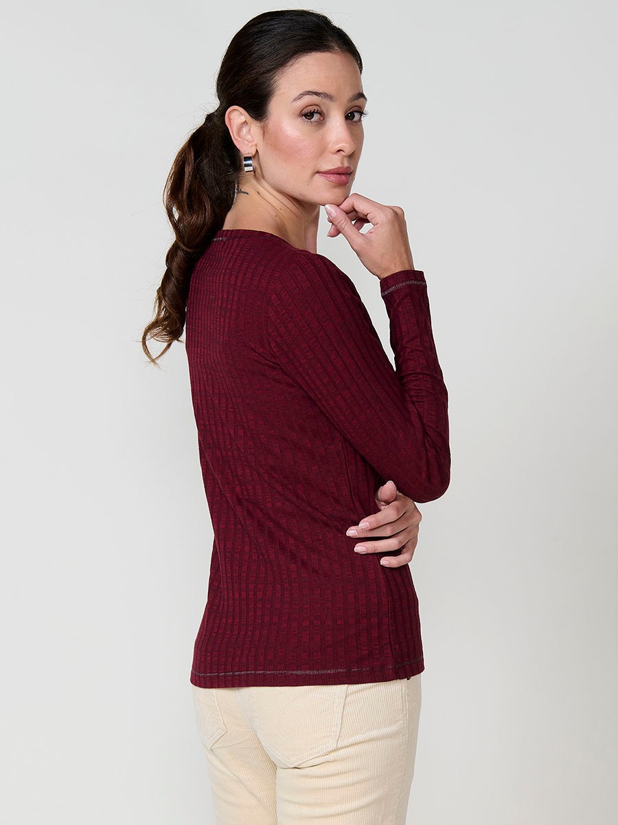 Women’s long sleeve ribbed top with melange effect, V-neckline and ethnic motif with studs and shiny accents.