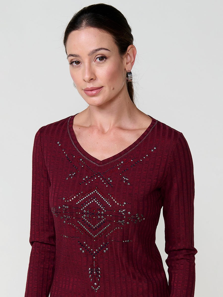 Women’s long sleeve ribbed top with melange effect, V-neckline and ethnic motif with studs and shiny accents.