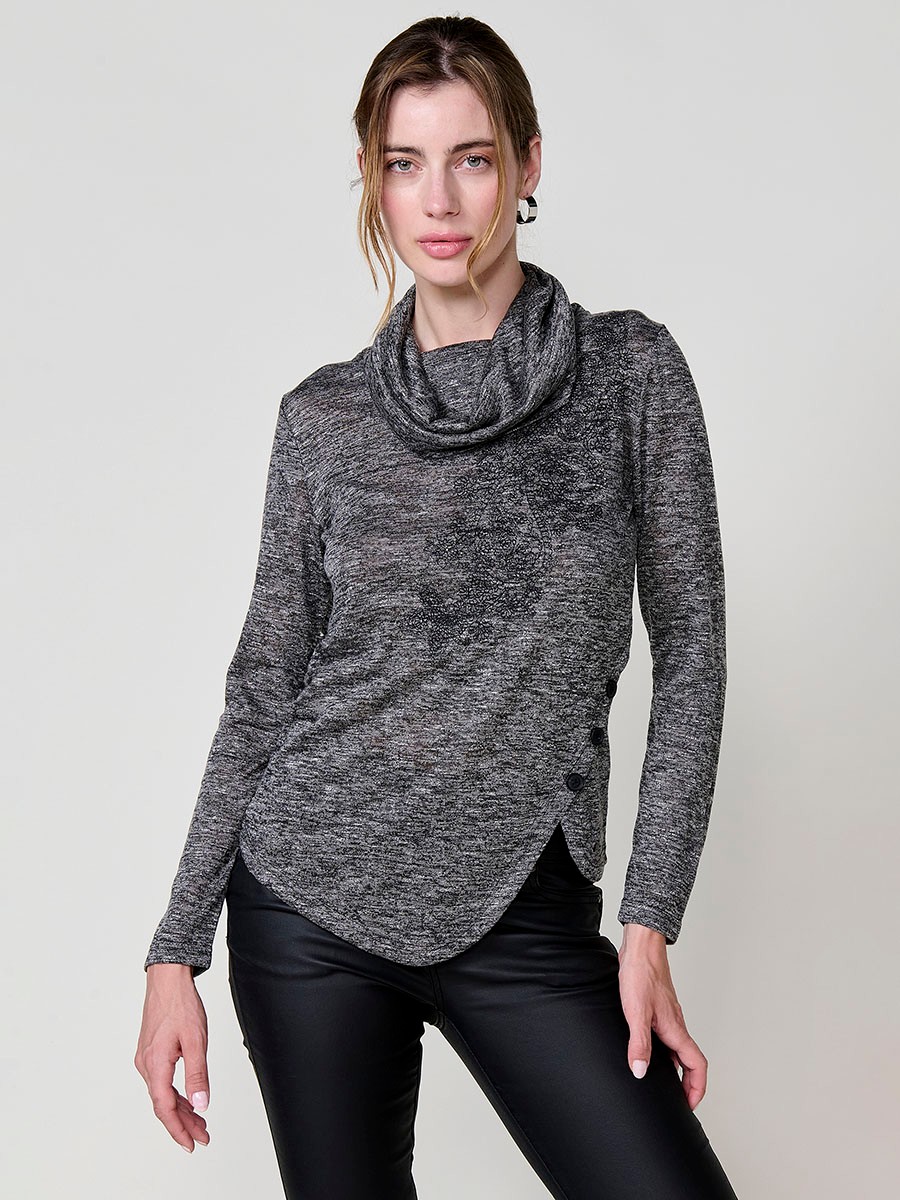 Women’s long sleeve turtleneck top in flamé melange fabric with asymmetric hem, diagonal buttons and shiny embroidery.