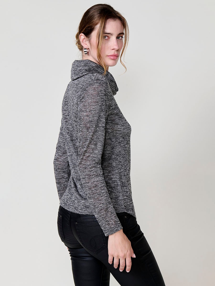 Women’s long sleeve turtleneck top in flamé melange fabric with asymmetric hem, diagonal buttons and shiny embroidery.
