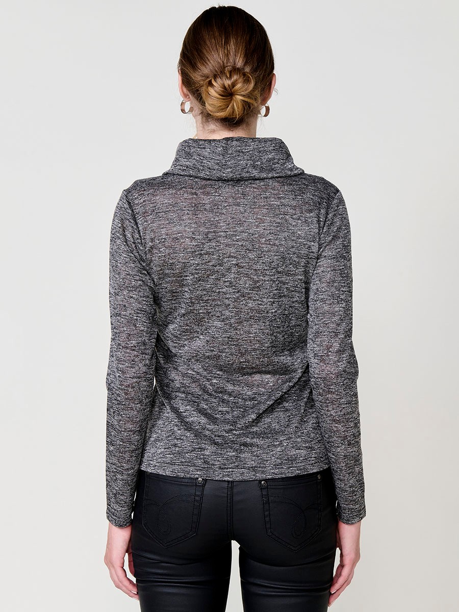 Women’s long sleeve turtleneck top in flamé melange fabric with asymmetric hem, diagonal buttons and shiny embroidery.